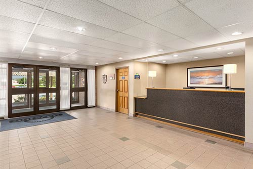 The spacious lobby and front desk of the Days Inn Stephenville Hotel located near the Stephenville airport